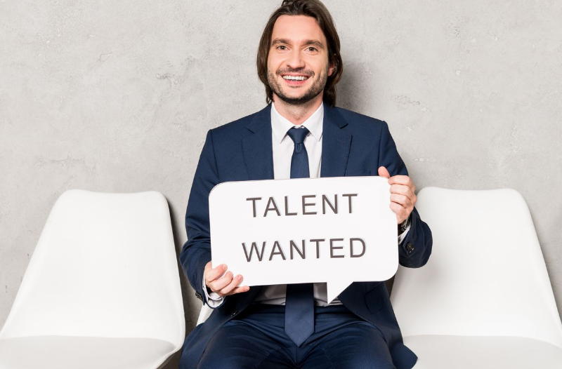 Can small businesses find the right talent? Yes, if they use better tactics than this man holding a sign saying talent wanted!