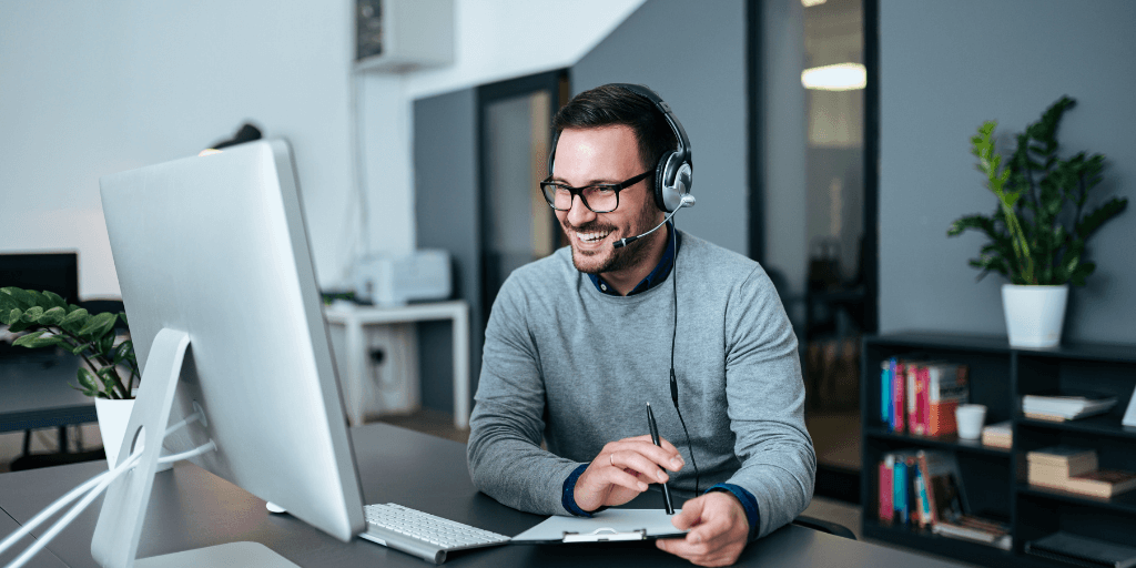 Tech support engineer using his communication skills to solve a problem for a customer.