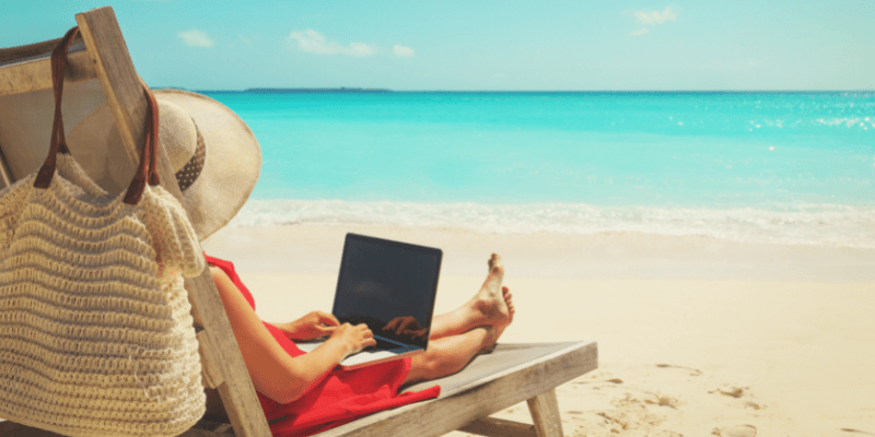 Employee working remotely from an exotic beach location
