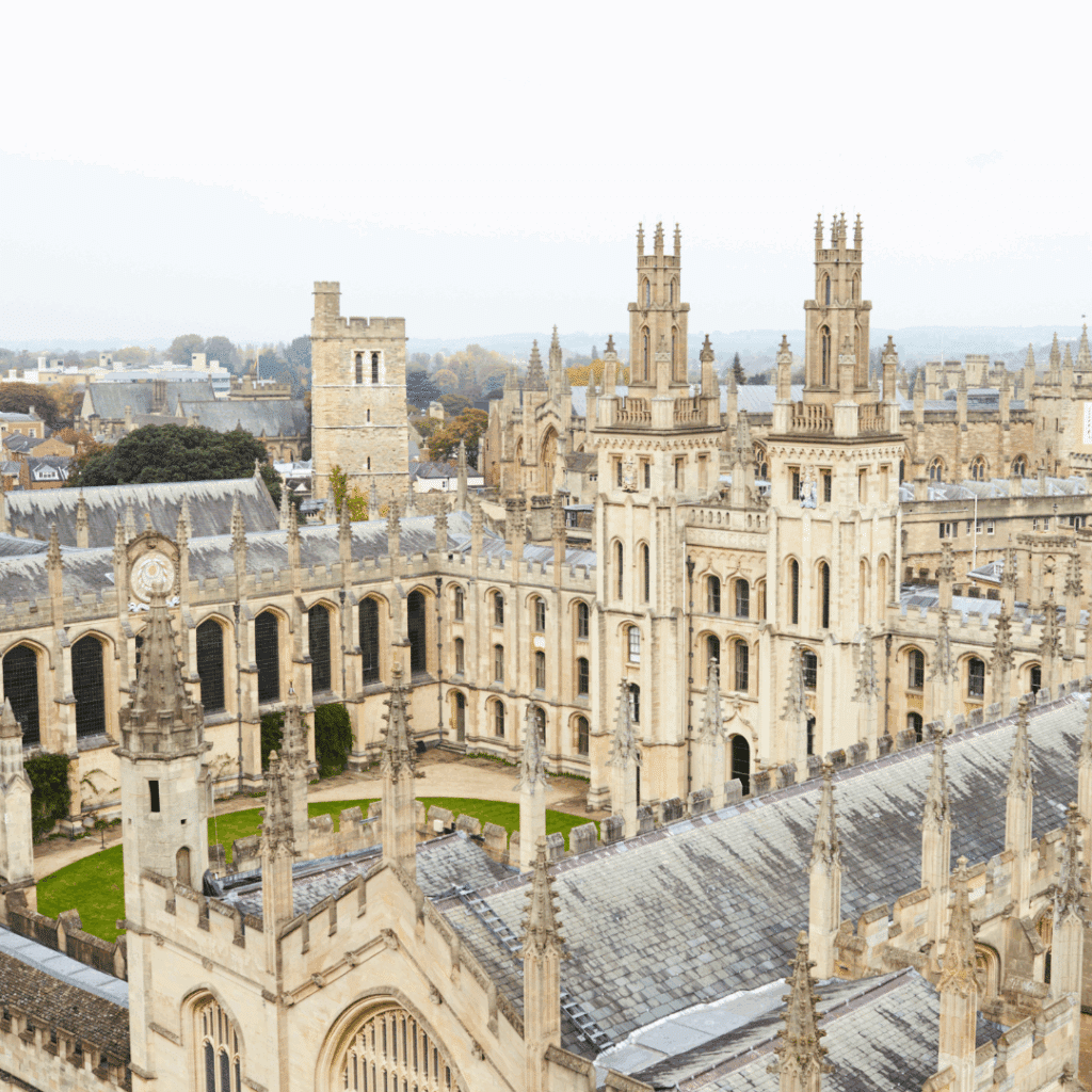 Elevated view of the inner courtyard and spires of All Souls College, Oxford, showcasing its stunning Gothic architecture.