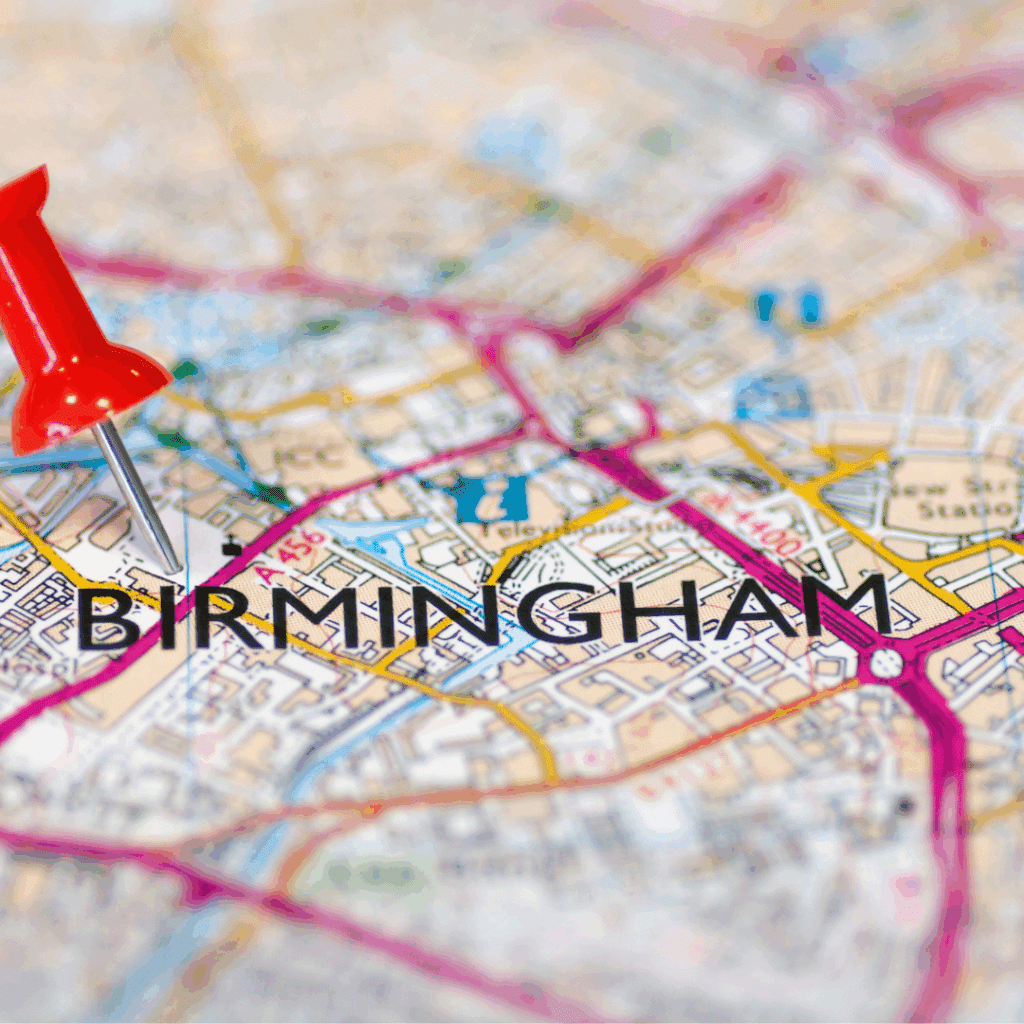 Close-up of a map highlighting Birmingham with a red pin placed in the city centre area.