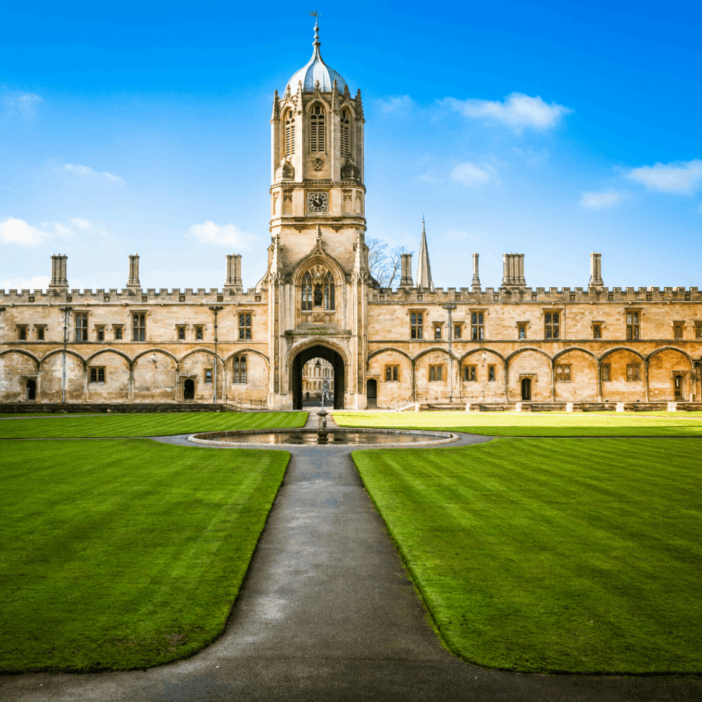The main entrance of Christ Church College in Oxford, featuring its tall Tom Tower and symmetrical courtyard.