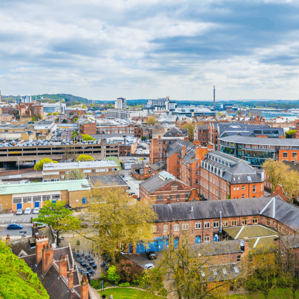 An aerial view of Nottingham showing the city’s blend of historic and modern buildings stretching across the skyline.