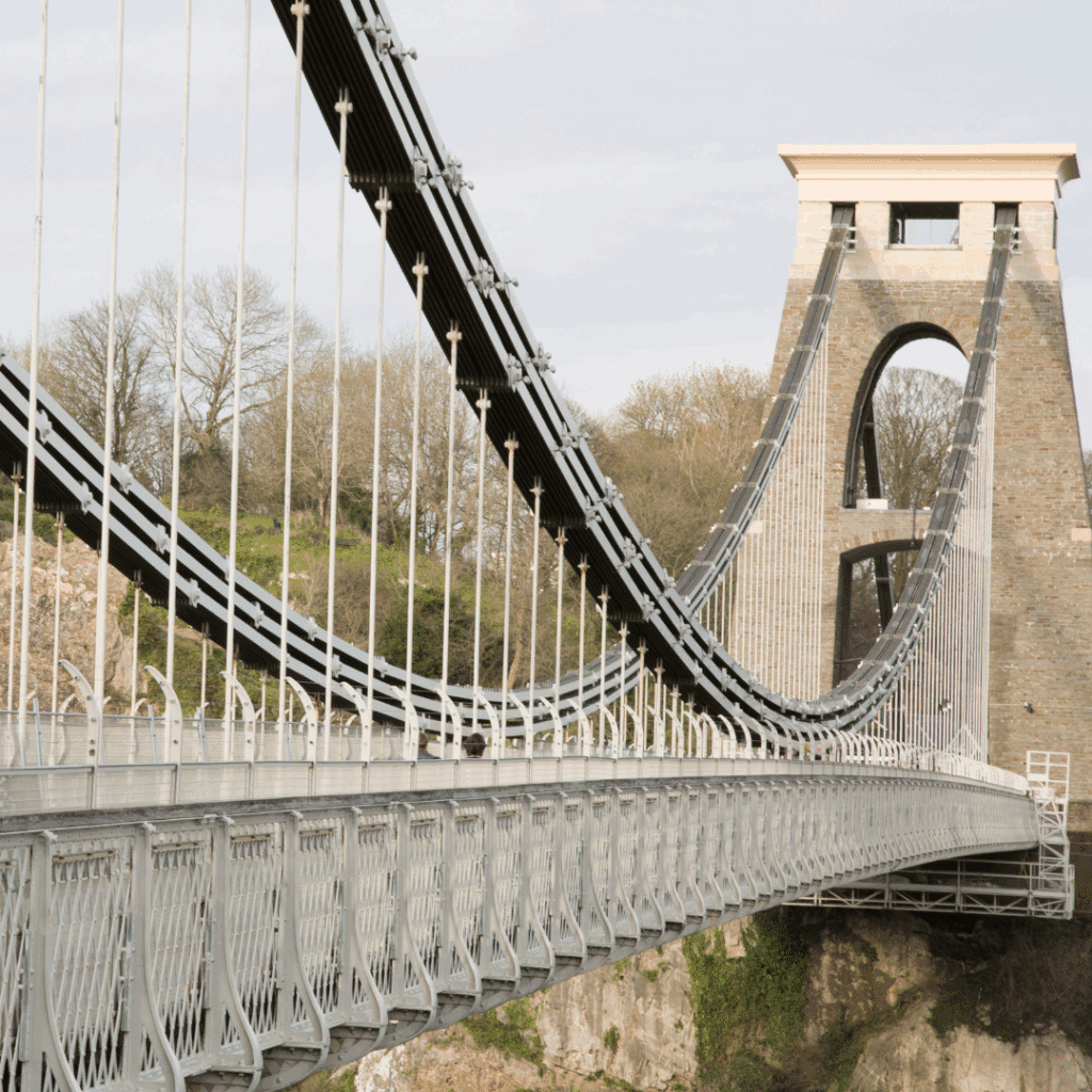 Side view of Clifton Suspension Bridge showing its iconic suspension cables.