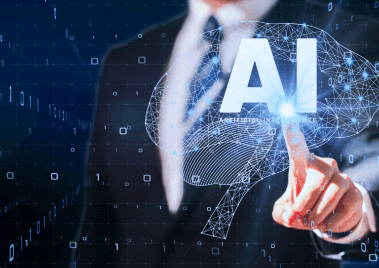 A businessman in a suit pointing at a glowing "AI" graphic overlaid on a digital brain illustration, symbolising artificial intelligence in business technology.