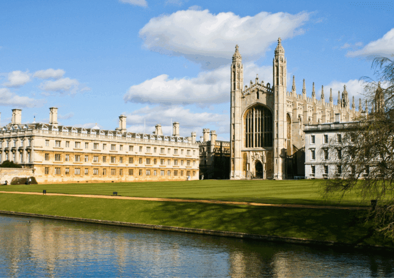Historic view of King's College Chapel and surrounding buildings on a bright spring day in Cambridge, UK.