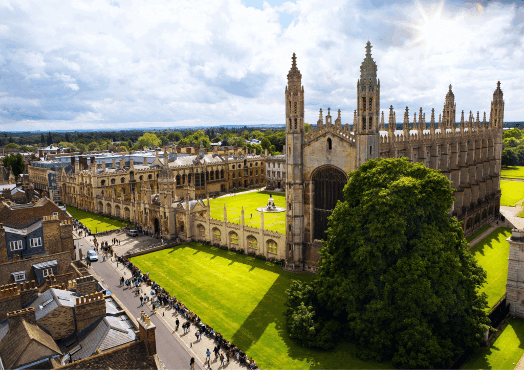 High-angle shot of King's College Chapel and central Cambridge, showcasing historic architecture and bustling streets.