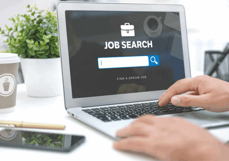 Person using a laptop with a job search website open on the screen, showing a search bar for finding career opportunities.