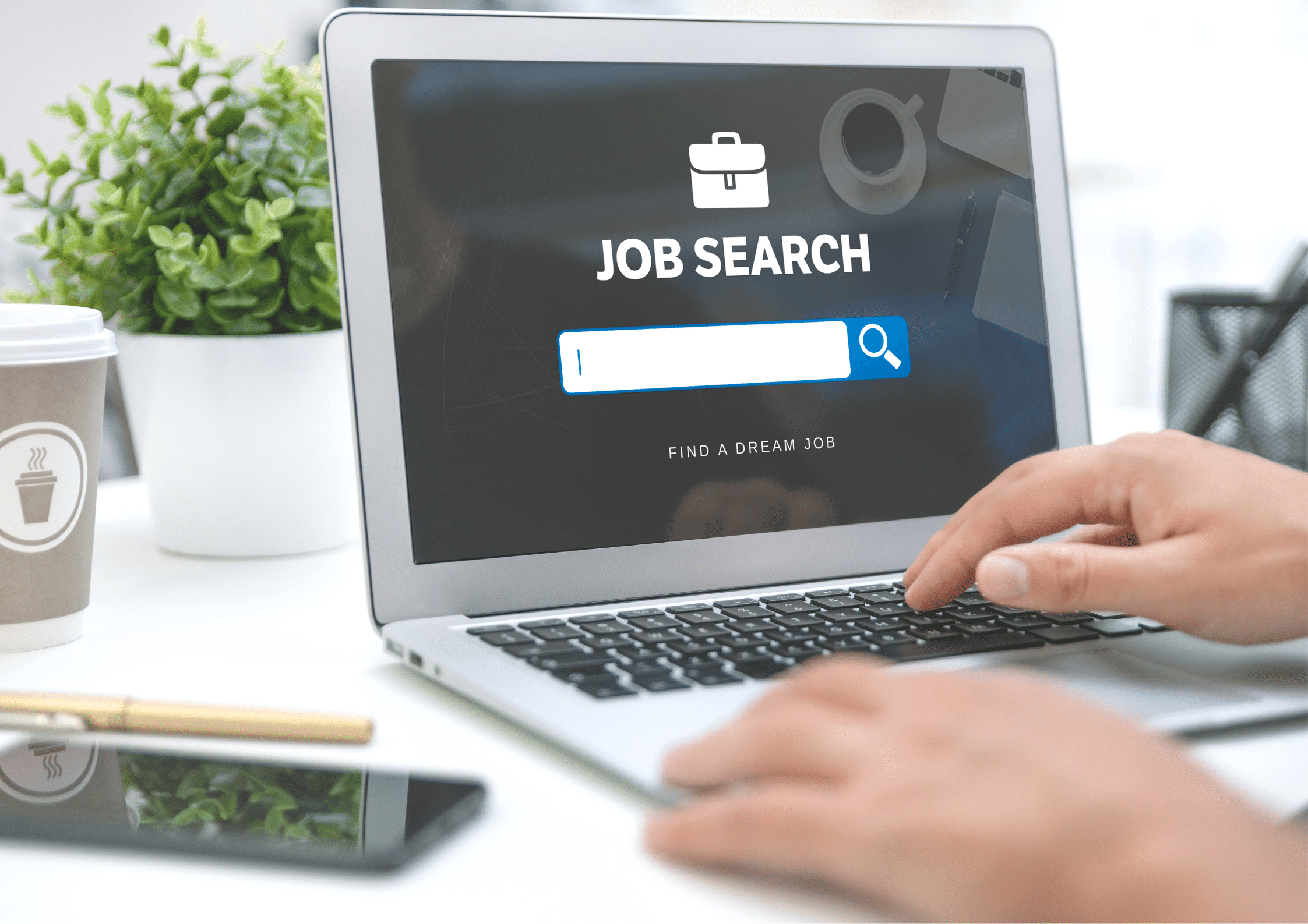 Person using a laptop with a job search website open on the screen, showing a search bar for finding career opportunities.