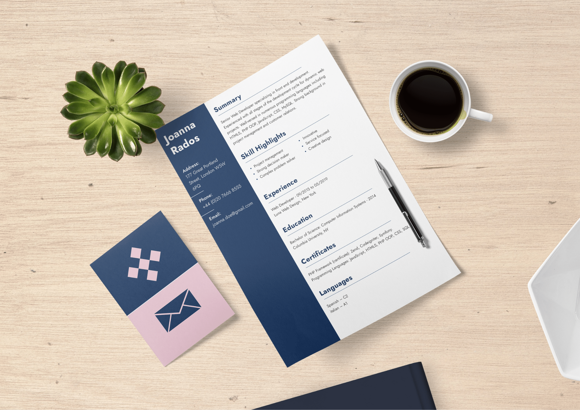 A professional CV design featuring a blue sidebar and clean typography, placed on a wooden desk with a coffee cup, plant, and stationery. An ideal example of an ATS friendly resume layout.